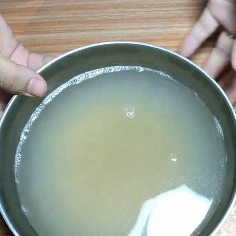 Step 2 Boil and separate the carp meat for Carp congee with lotus seeds