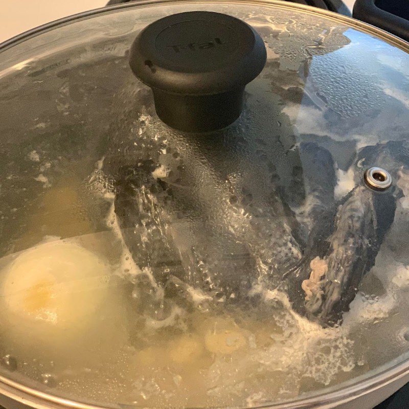 Step 2 Cooking porridge Black chicken porridge with lotus seeds (recipe shared by user)