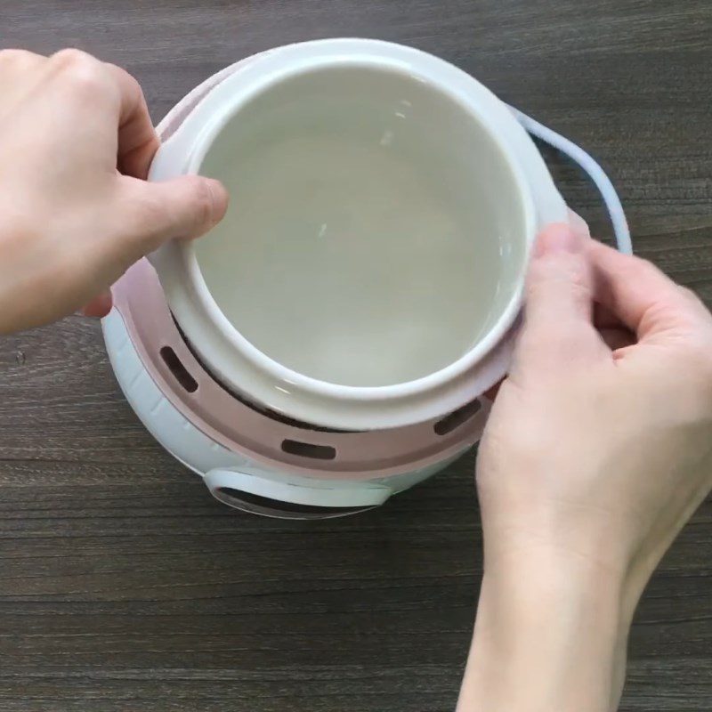 Step 3 Cook the white porridge and steam the ingredients Salmon porridge using a slow cooker