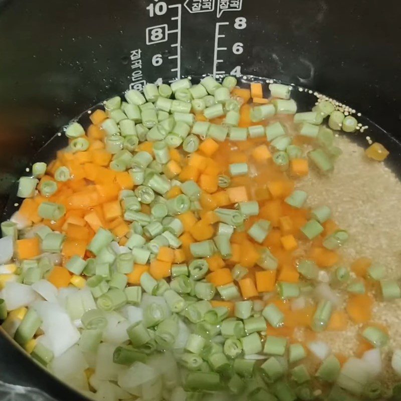 Step 3 Cooking quinoa with vegetables Quinoa mixed with vegetables cooked in a rice cooker