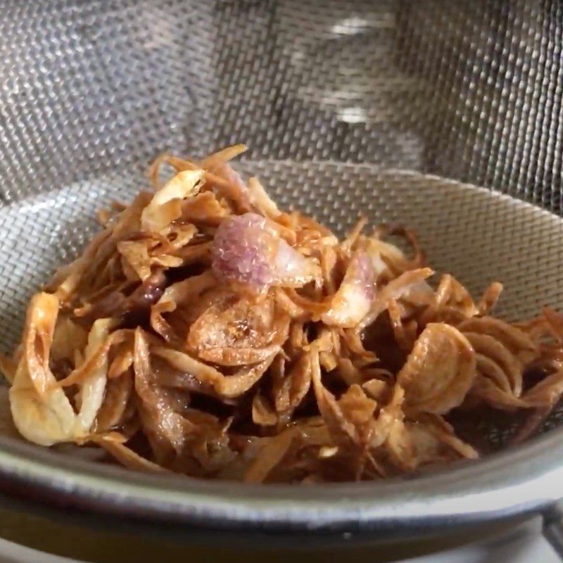 Step 4 Sautéing Red Onions for Sour Bamboo Shoot Fish Hotpot