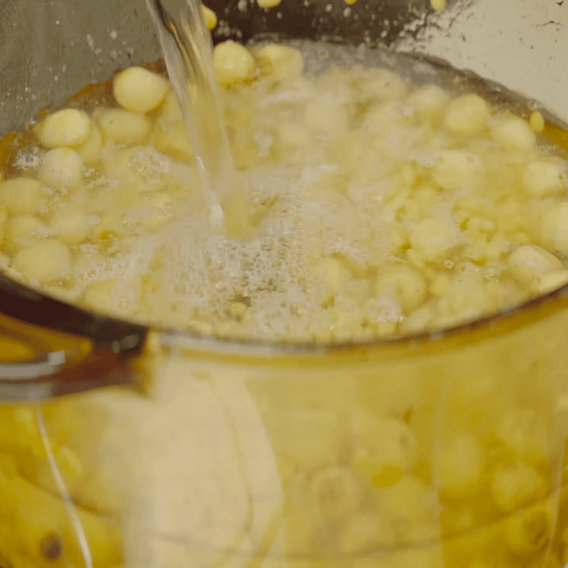 Step 2 Sauté green beans and lotus seeds with sugar, simmer until soft for Green Bean and Lotus Seed Sweet Soup