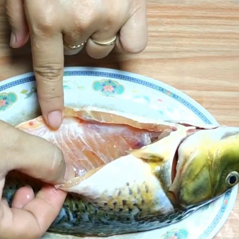 Step 1 Prepare the carp for Carp congee with lotus seeds