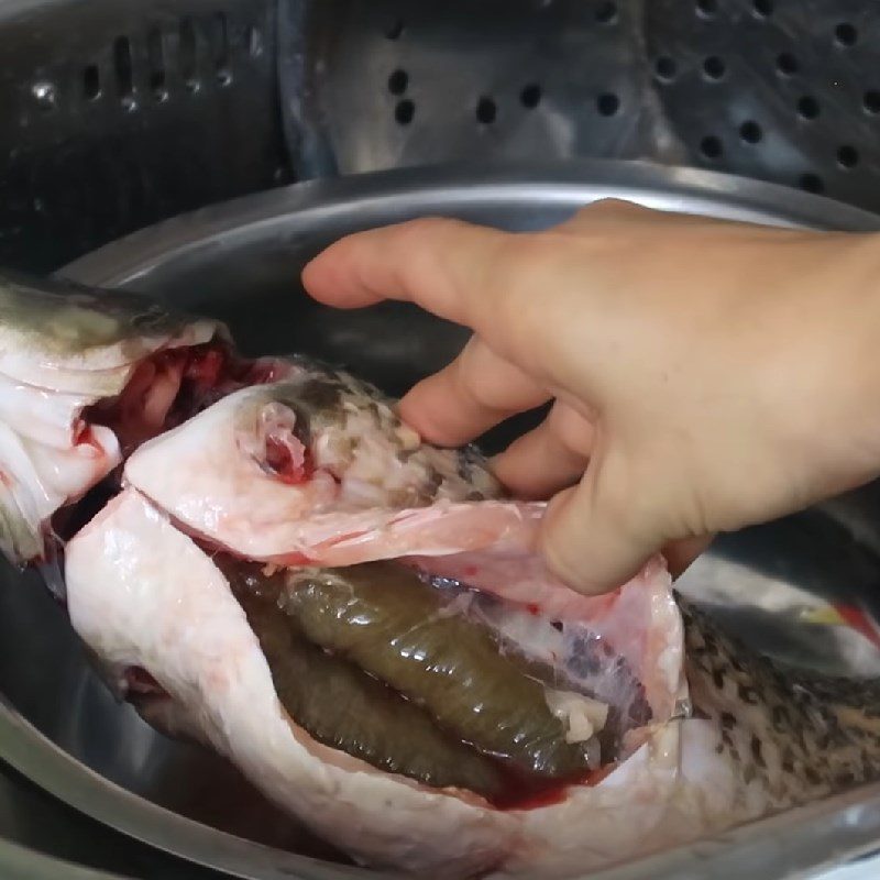 Step 1 Prepare the carp for Carp Hotpot