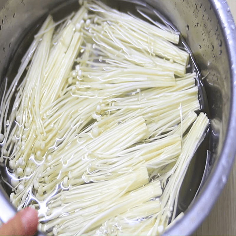 Step 1 Prepare the mushrooms for Pork belly rolls with enoki mushrooms