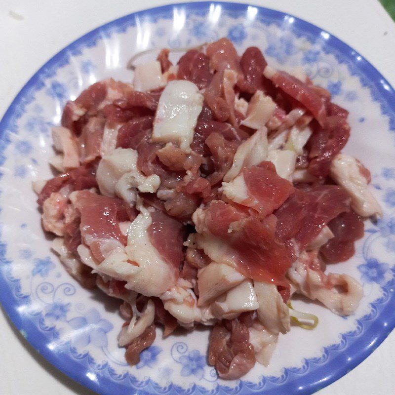 Step 1 Preparing pork Pork stir-fried with purple onion