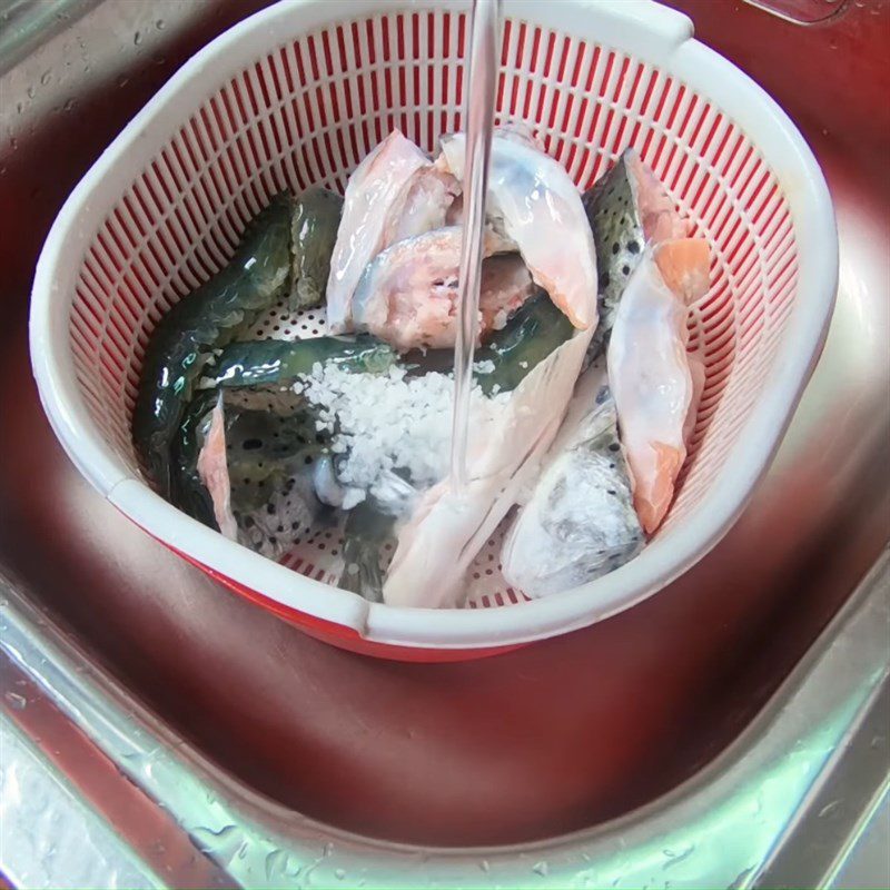 Step 1 Prepare and marinate shrimp and fish for Sour Salmon Head Soup with Shrimp