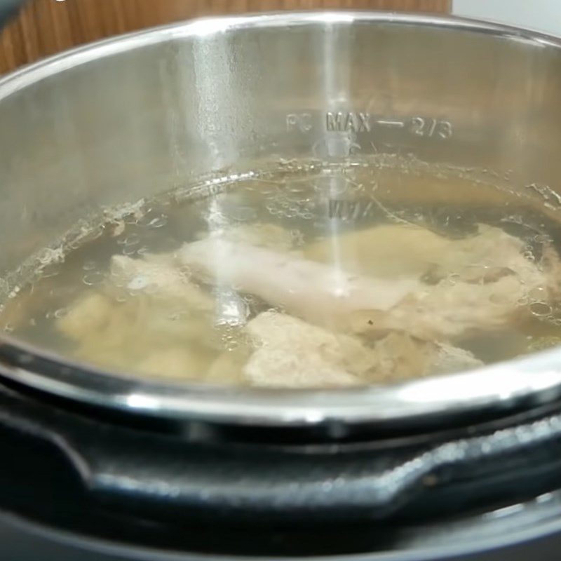Step 1 Prepare the pork bones and simmer the broth for Tom Yum Hot Pot