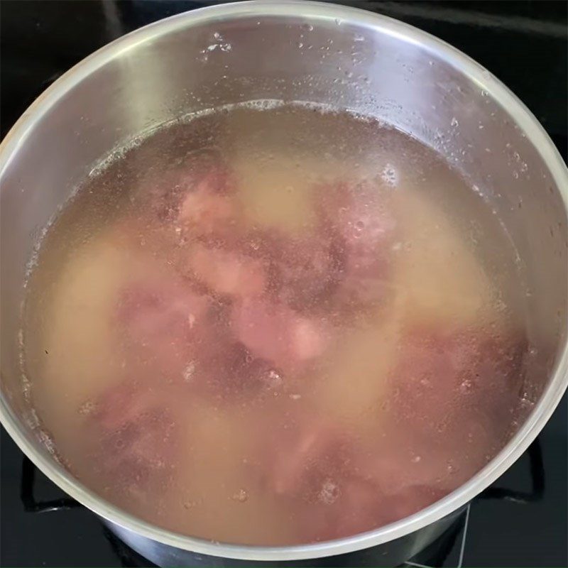 Step 2 Mix rice and cook bones Chao Tieu