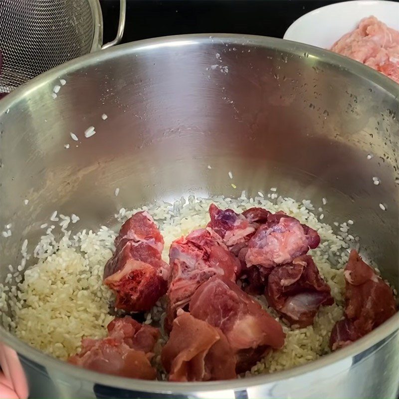 Step 2 Mix rice and cook bones Chao Tieu