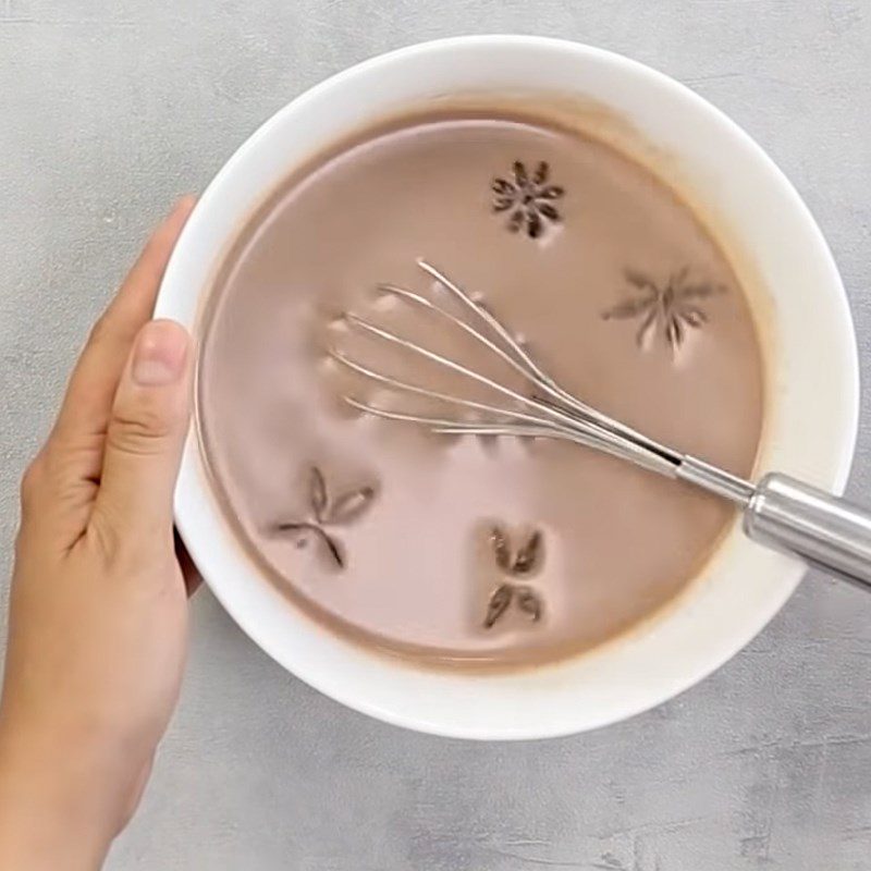 Step 1 Mix the cocoa and coconut milk mixture for Grilled Gan Cake from the Western Region