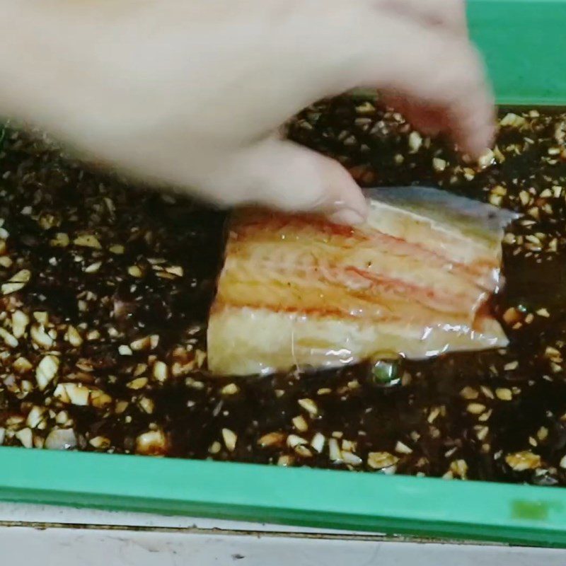 Step 3 Marinating catfish Dried catfish marinated in soy sauce