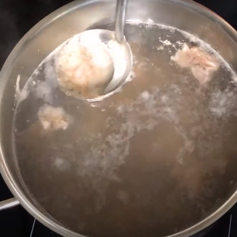 Step 2 Simmer the bones for Bánh canh gõ gáo dừa chả cá lăng