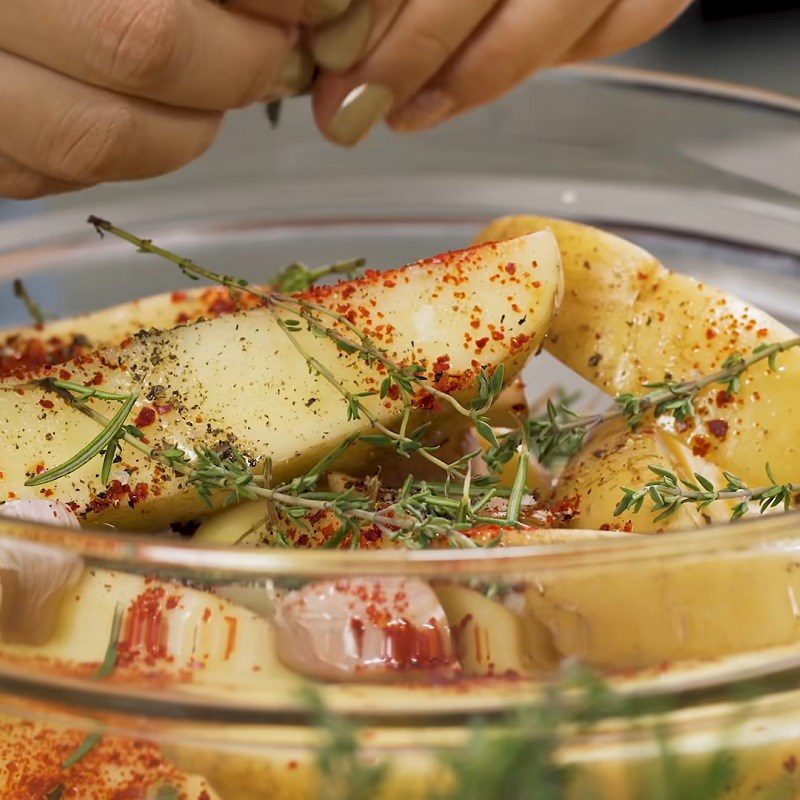 Step 2 Season the potatoes for cheesy baked potatoes using an air fryer