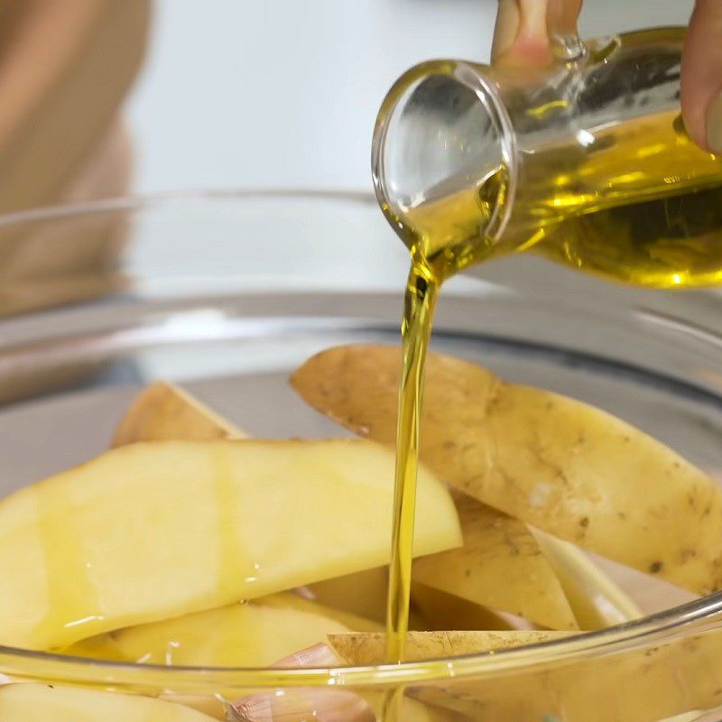 Step 2 Season the potatoes for cheesy baked potatoes using an air fryer