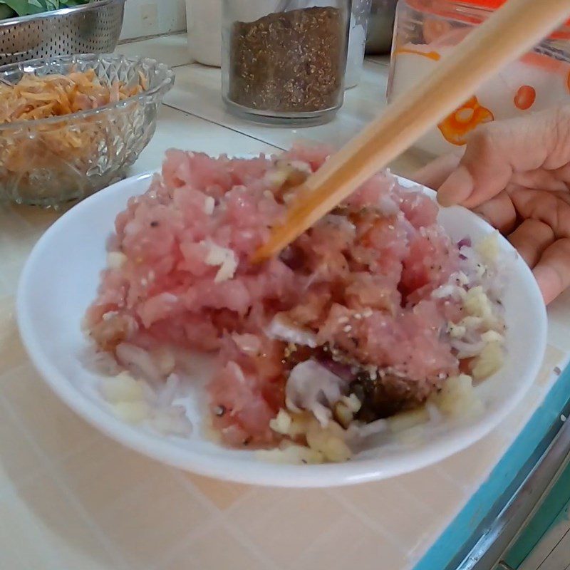 Step 2 Marinating the meat for Duck Egg Porridge