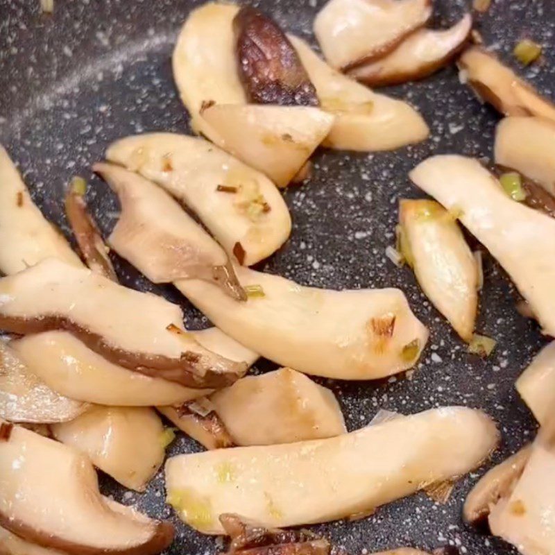 Step 3 Sautéing mushrooms Banana flower salad mixed with chicken thigh mushrooms