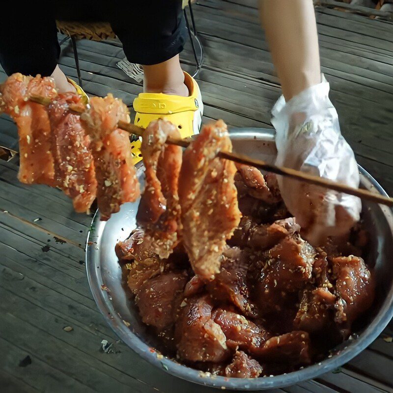 Step 3 Skewer the meat Dried pork hanging on the stove