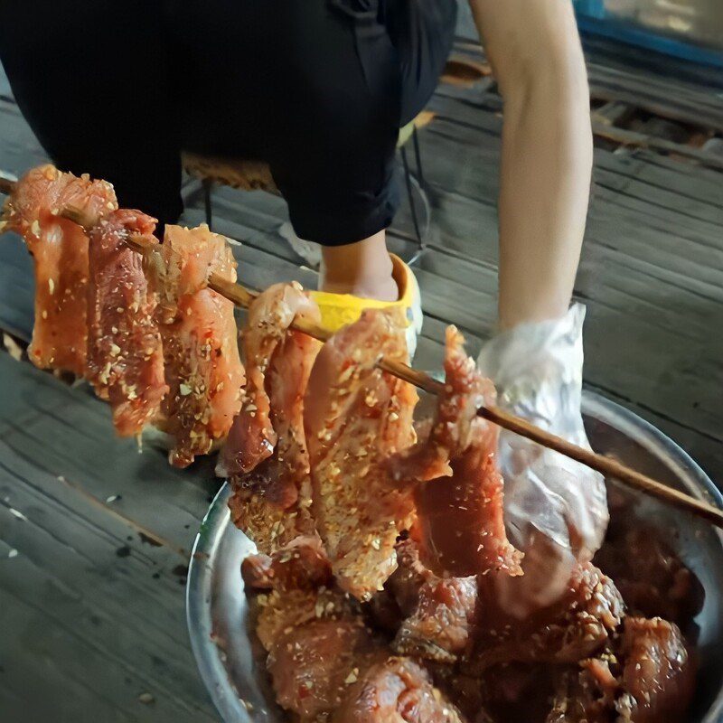 Step 3 Skewer the meat Dried pork hanging on the stove
