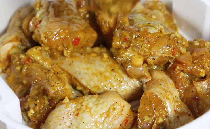 Step 2 Marinate chicken Chicken cooked with lemongrass and turmeric using a rice cooker