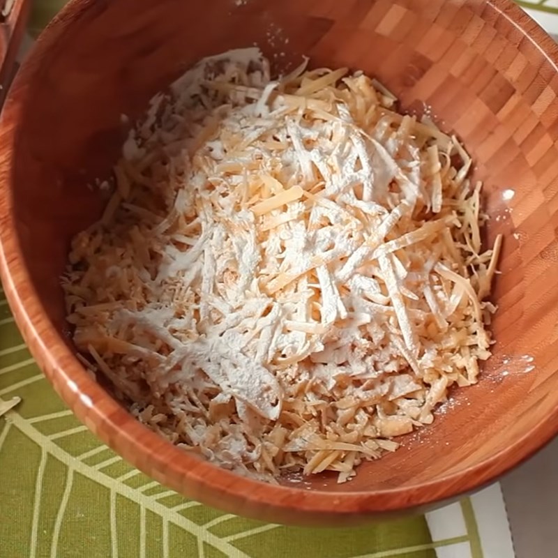 Step 1 Grate cheese for Cheese Fondue