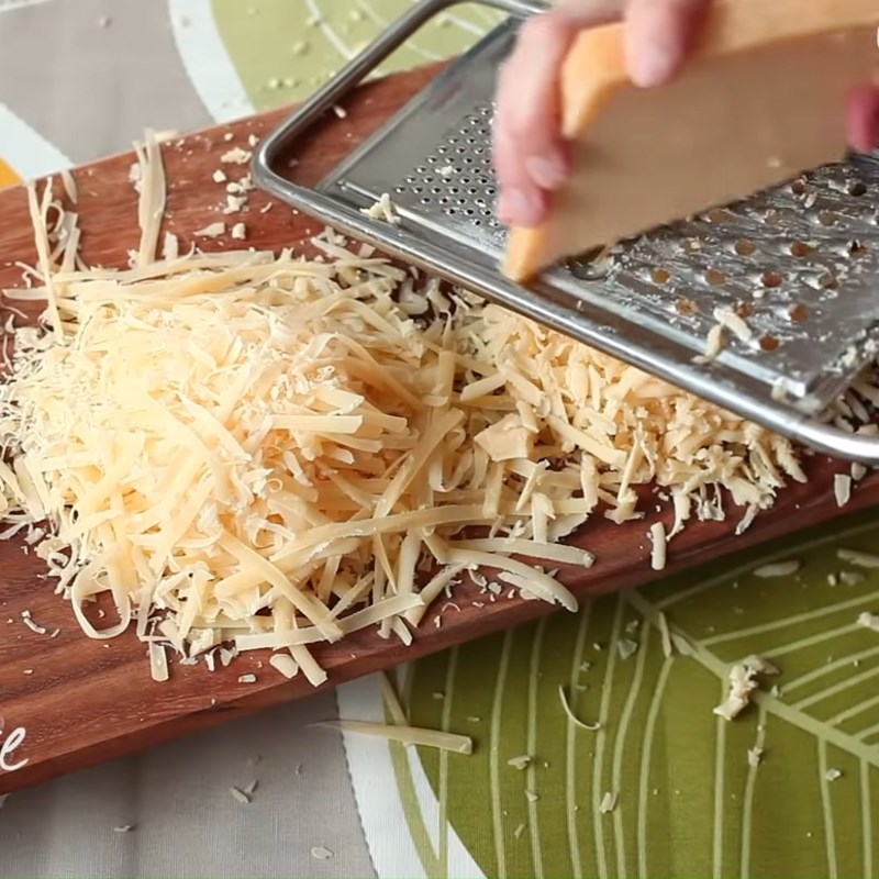 Step 1 Grate cheese for Cheese Fondue
