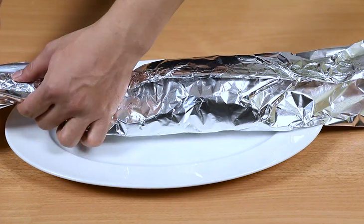 Step 3 Wrap the fish in aluminum foil Grilled barramundi in aluminum foil