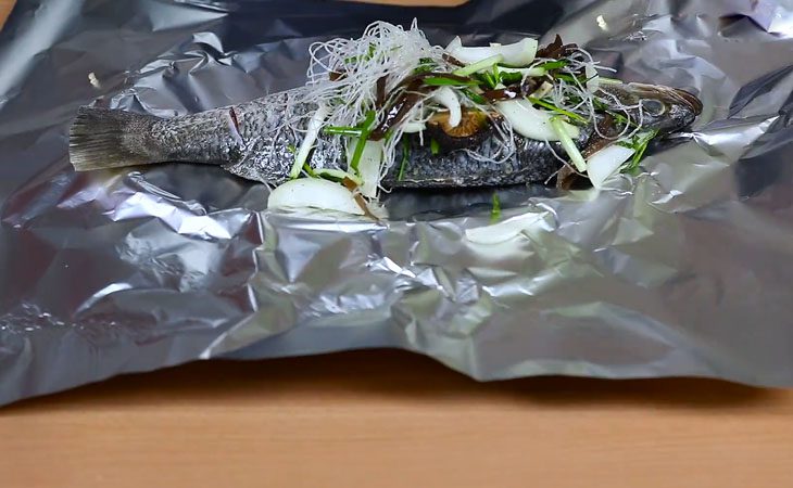 Step 3 Wrap the fish in aluminum foil Grilled barramundi in aluminum foil