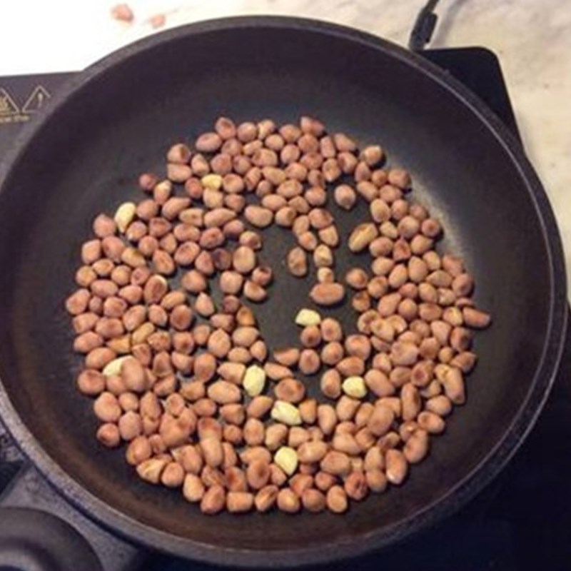 Step 1 Roasting peanuts How to make peanut (groundnut) sticky dough dessert