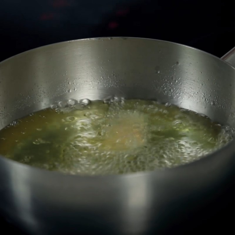 Step 4 Fry the cake Spicy cassava meat cake