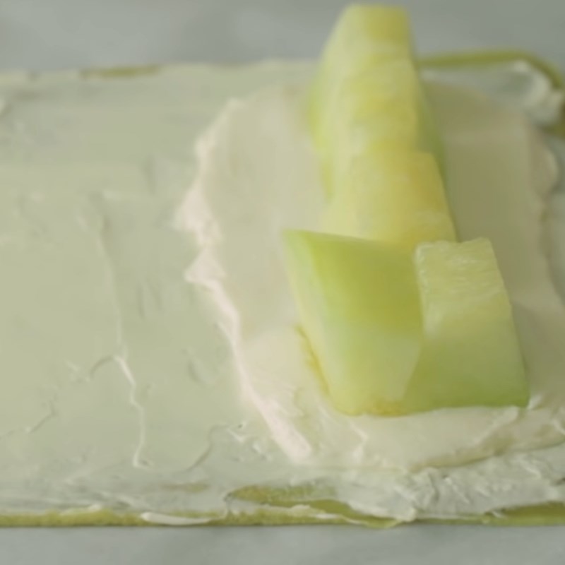 Step 6 Rolling the cake Melon crepe roll