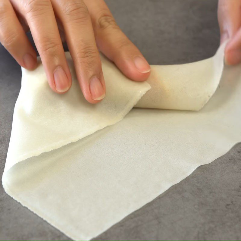 Step 7 Rolling the spring rolls for beef mushroom spring rolls