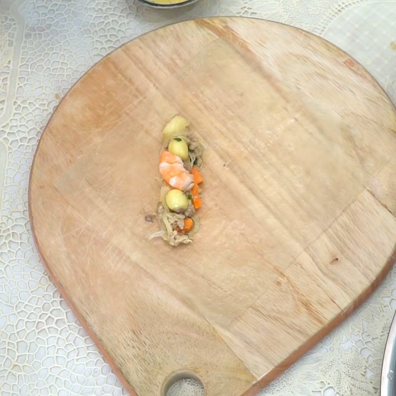 Step 5 Rolling the spring rolls Lotus seed spring rolls