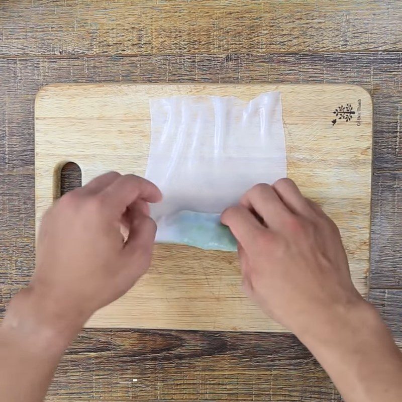 Step 2 Rolling the rice paper with minced pork