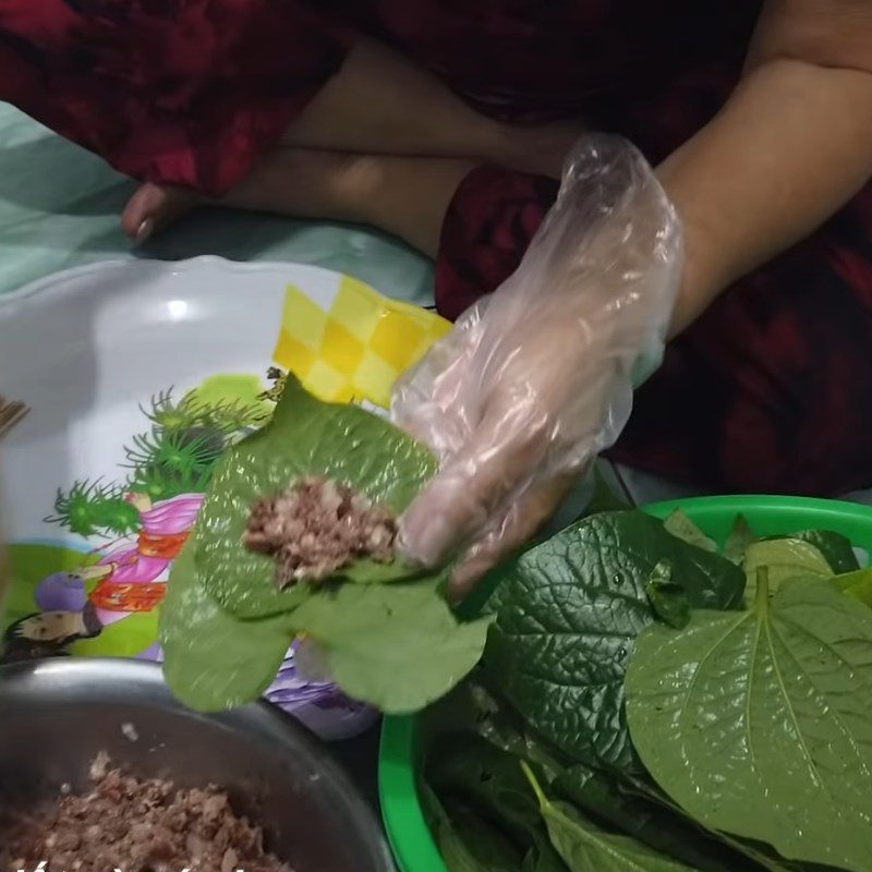 Step 3 Wrap buffalo meat in wild betel leaves Buffalo meat wrapped in wild betel leaves grilled