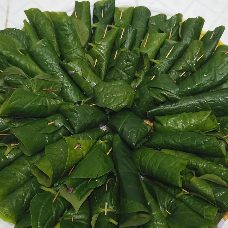 Step 3 Wrap buffalo meat in wild betel leaves Buffalo meat wrapped in wild betel leaves grilled