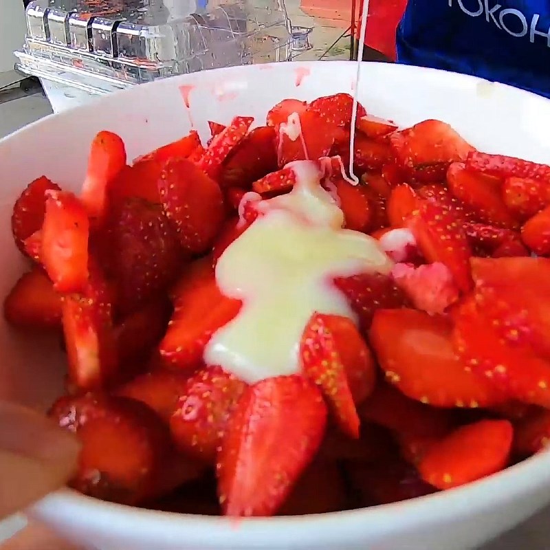 Step 2 Soak strawberries with condensed milk Strawberries soaked in condensed milk