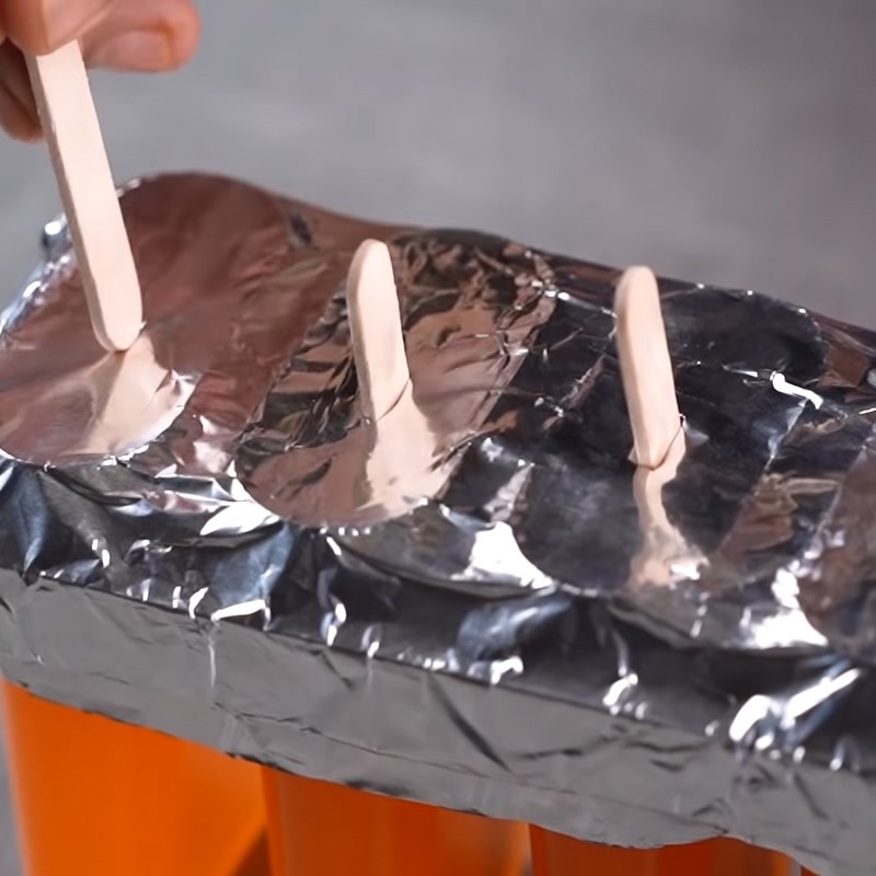 Step 4 Pouring and Cooling Orange Popsicle