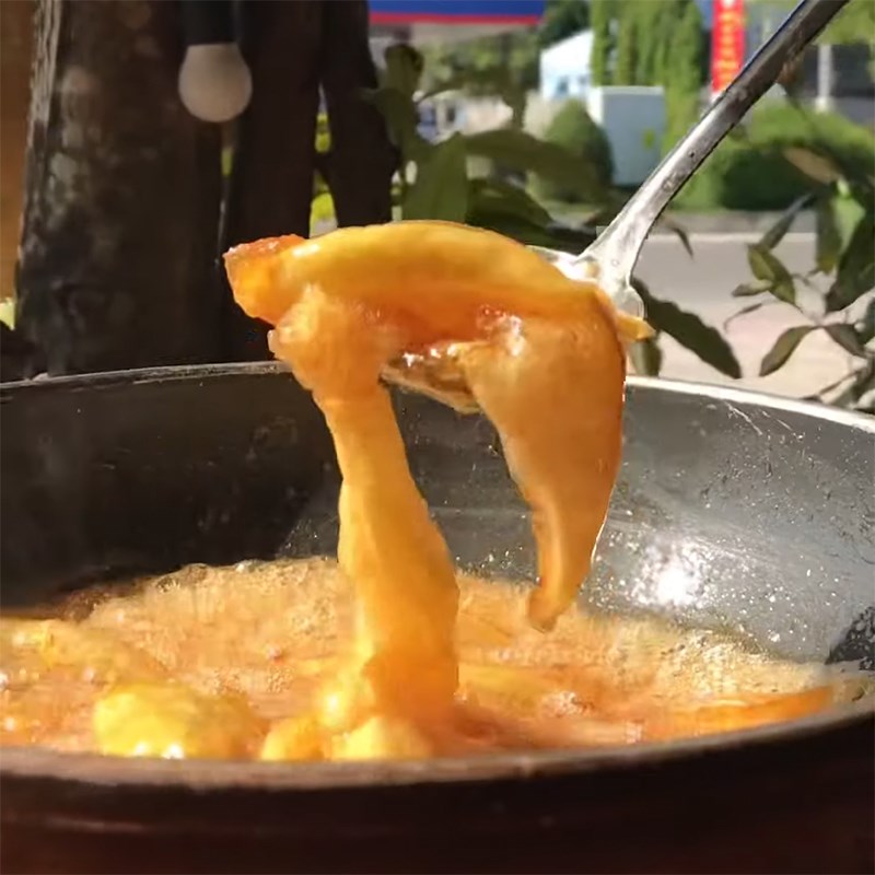 Step 3 Stewing mango soaked in green mango soda with sugar