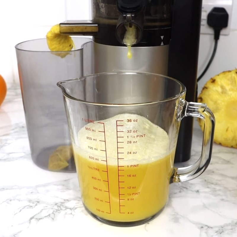Step 2 Juice the Orange and Pineapple for Red Artichoke Flower Pineapple Orange Tea