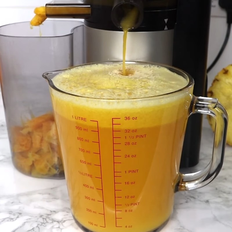 Step 2 Juice the Orange and Pineapple for Red Artichoke Flower Pineapple Orange Tea