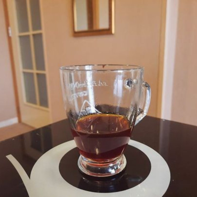 Step 2 Strain the tea and stir in the milk for macchiato black tea latte