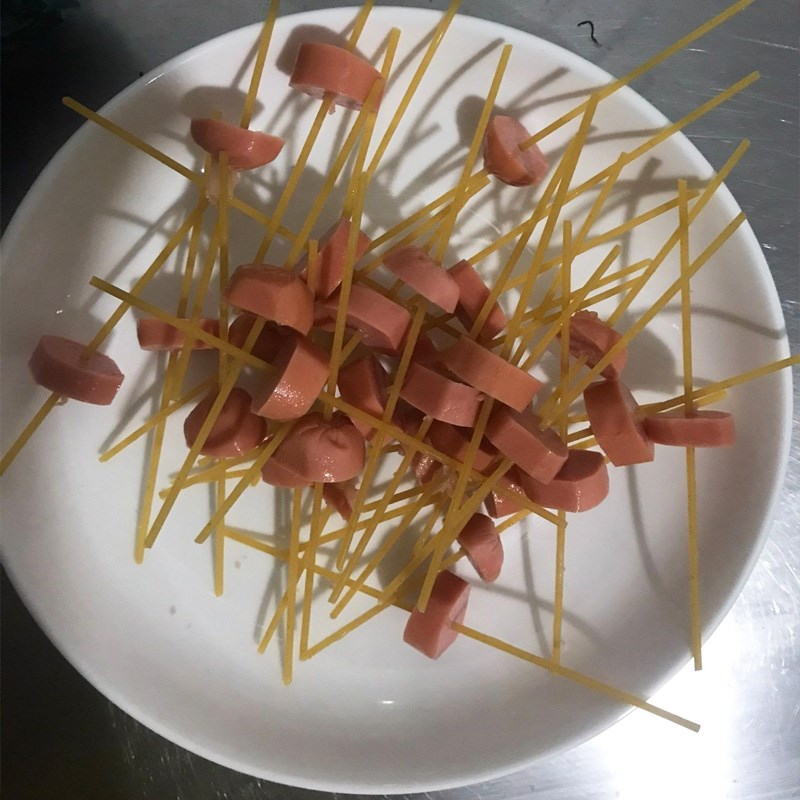 Step 2 Skewer spaghetti onto the sausage Spaghetti with sausage