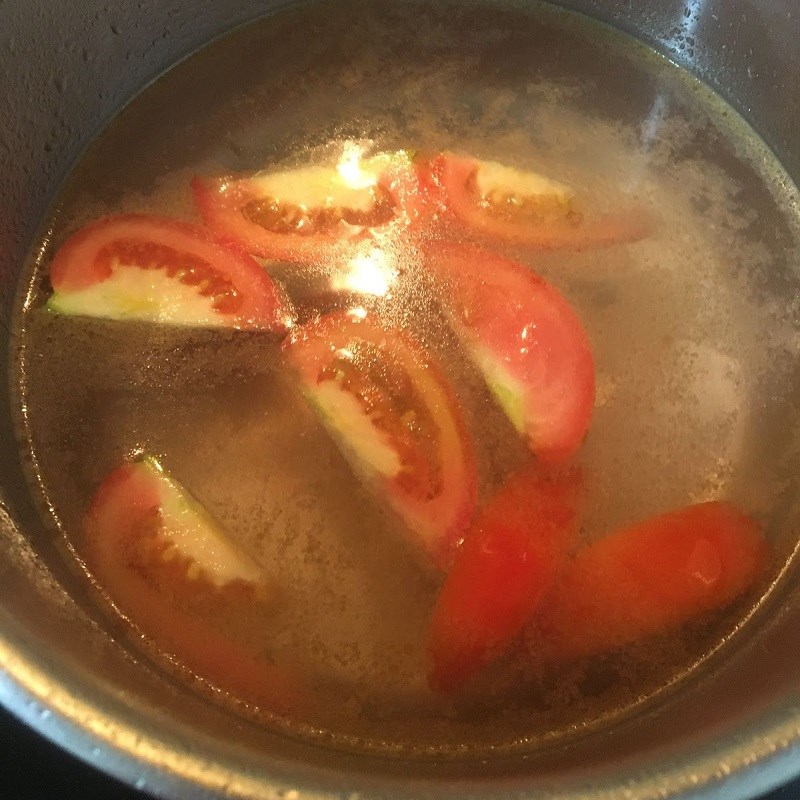 Step 3 Cook the soup Sour fish soup with bamboo shoots