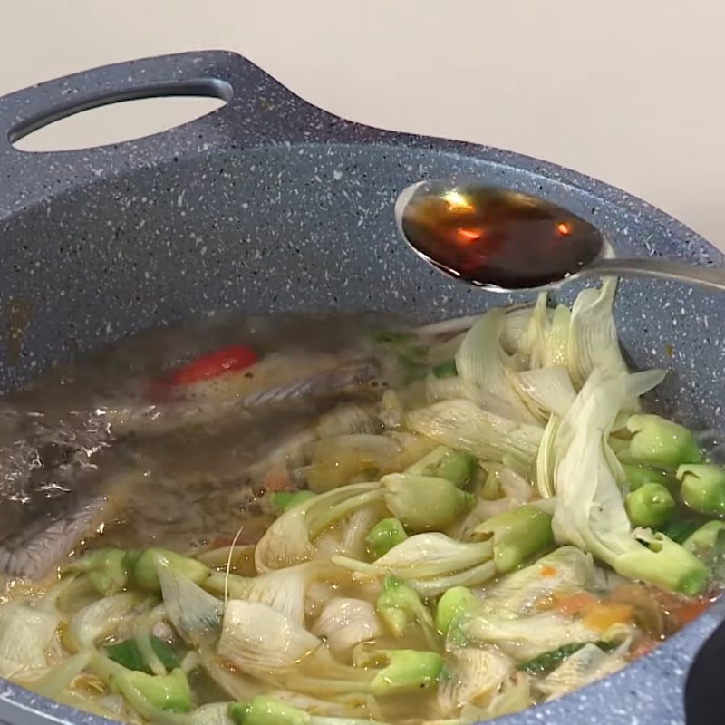 Step 5 Cooking the soup Sour soup with mudfish and water lily