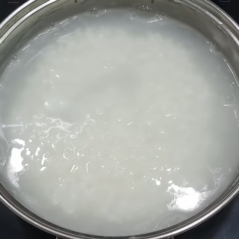 Step 3 Cook the porridge Duck Egg Porridge with Mustard Greens