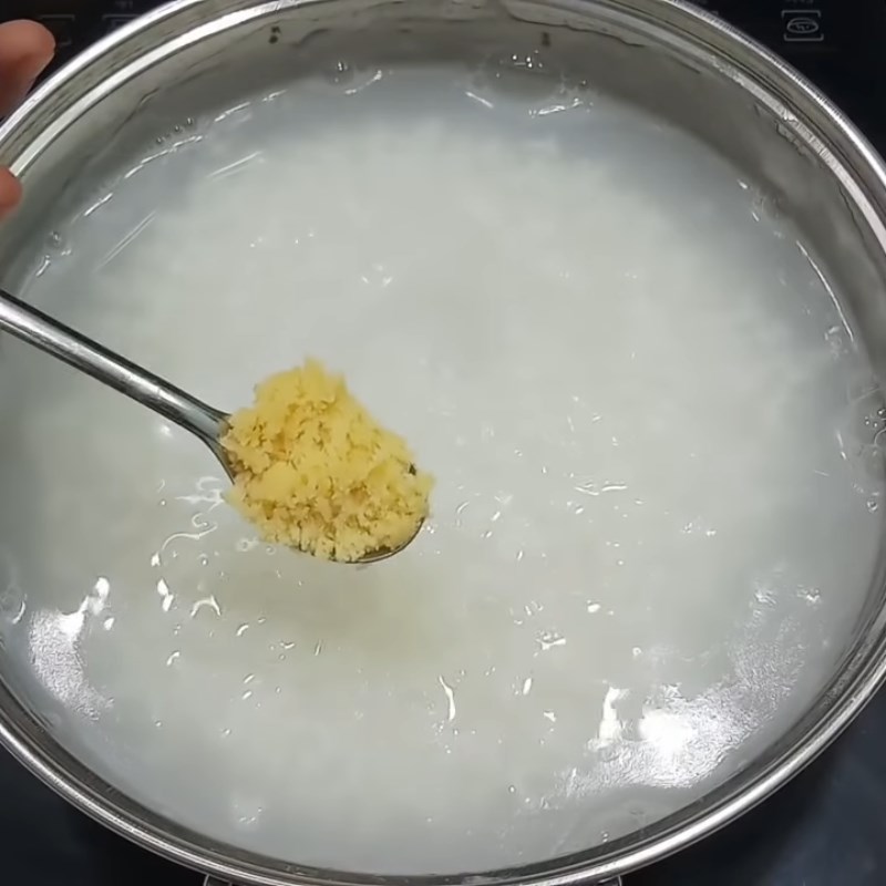 Step 3 Cook the porridge Duck Egg Porridge with Mustard Greens