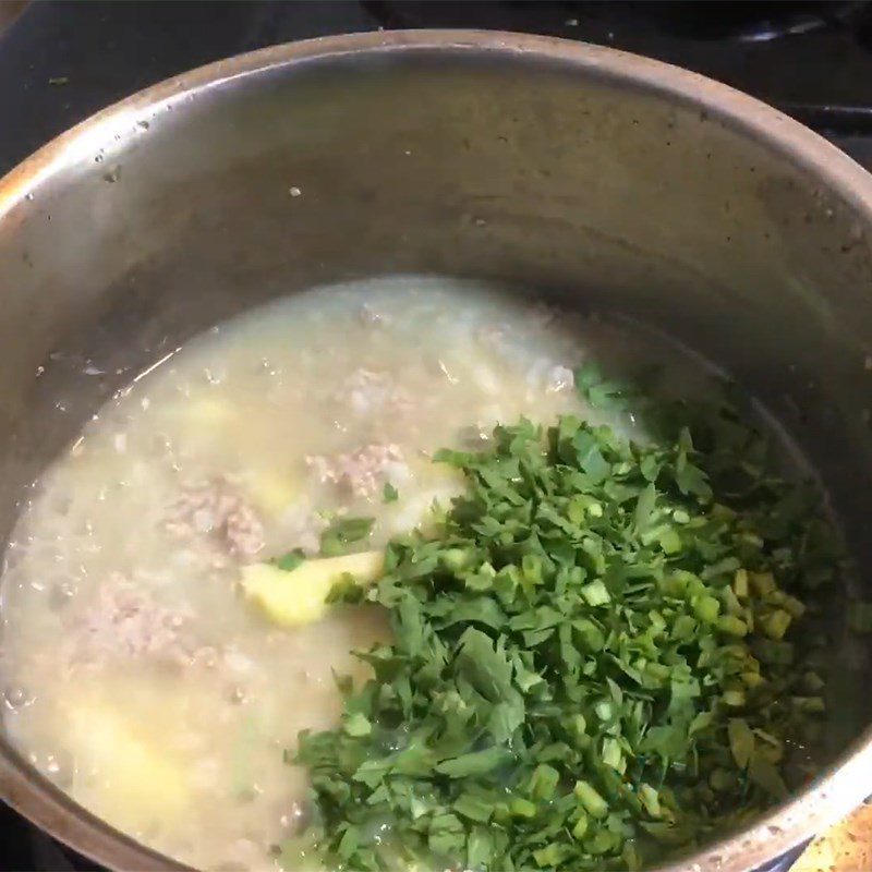 Step 3 Cook the porridge Goat meat porridge with taro and chrysanthemum greens