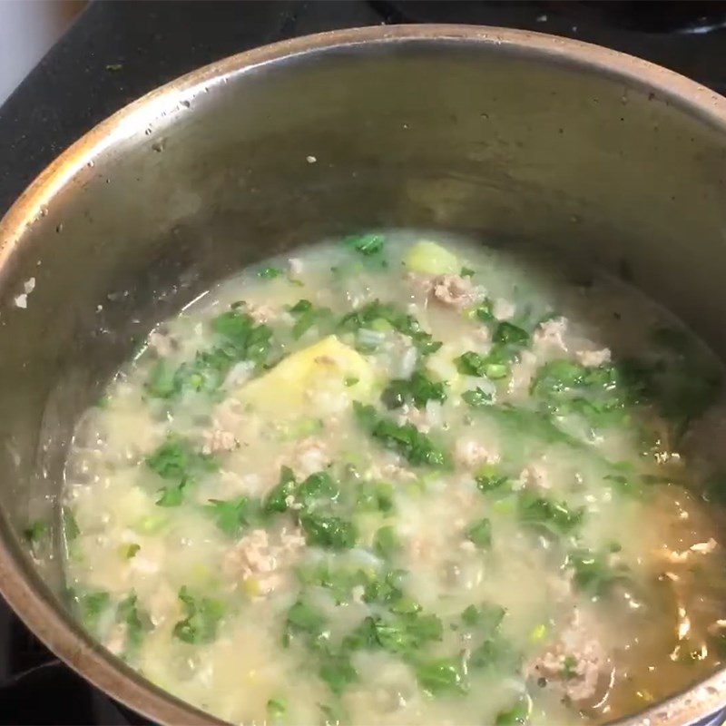 Step 3 Cook the porridge Goat meat porridge with taro and chrysanthemum greens