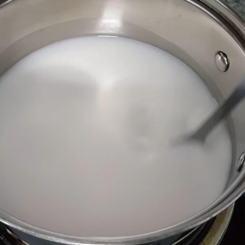 Step 2 Cook the coconut milk for Steamed Rice Cake from Fermented Rice